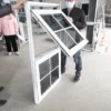 Aluminum awning windows wrapped and stacked in warehouse on pallets