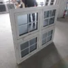 Aluminum awning windows aligned in rows at factory for inspection