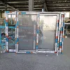 Aluminum sliding window photographed from interior and exterior perspectives