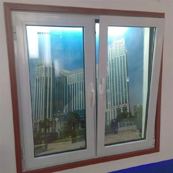 Close-up of PVC tilt and turn window hinge and dual-action handle