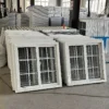 Forklift loading packaged vinyl sliding windows into export container